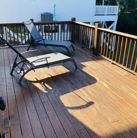 Back deck with 2 lounge chairs and gas grille