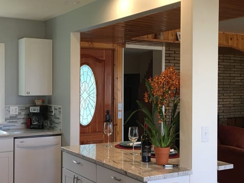 Looking at entry door from kitchen/dining area