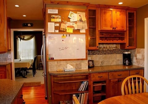 From kitchen dining toward dining room and wine cabinet.