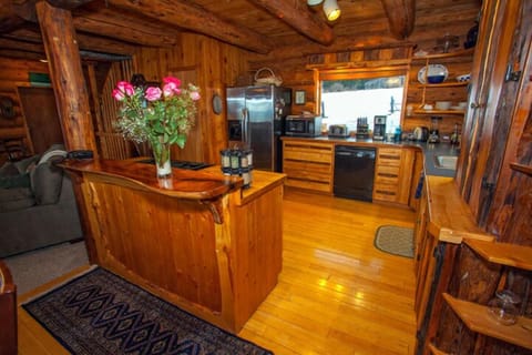 Custom Kitcher Koa Wood Island and bar with fully furnished kitchen.