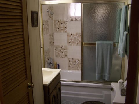 Combined shower/tub, hair dryer, towels, soap