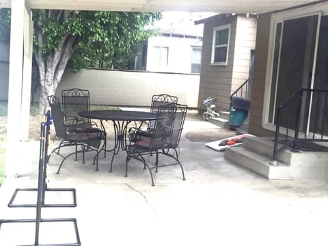 Backyard with outside seating and Charcoal BBQ
