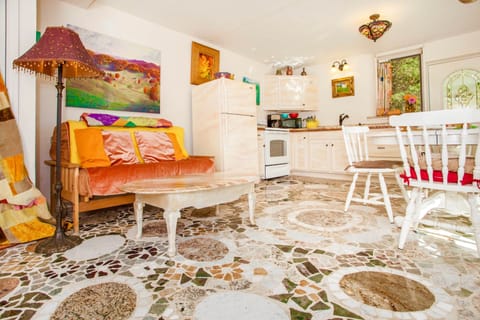 A stunning granite mosaic floor by Rachel adorns the lower level of cottage. 