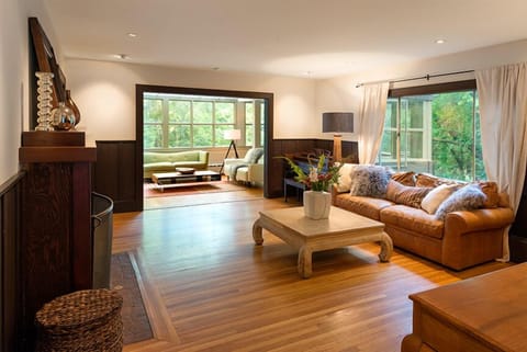 Living room with fireplace and pass through to sun room.