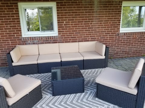 New outdoor sofa on the covered deck provides shade and comfort