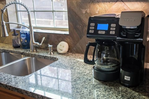 A traditional coffee pot is available along with basic soaps and supplies.