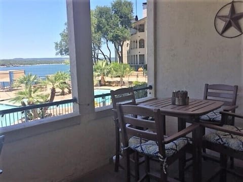 View from the balcony overlooking the pool and lake
