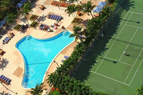 VIEW FROM OUR BALCONY OF POOL AND TENNIS COURT