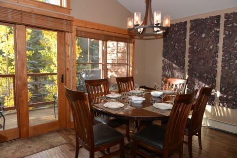 Bright dining room with large table seating for 6.  High chair provided.
