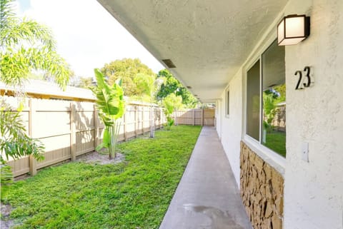 Fully Fenced-In Yard with Palm Trees
