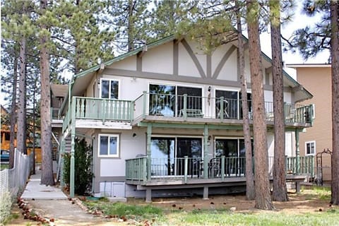 Summer exterior from lake, we are the top floor, perched high for beautiful view