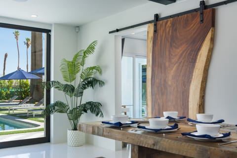 Giant parota slab barn door to bedroom