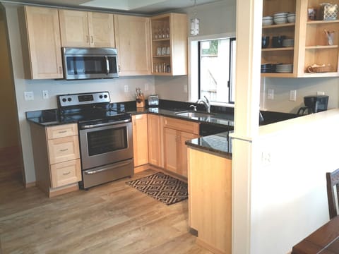 Granite Countertops, stainless appliances and Maple cabinets