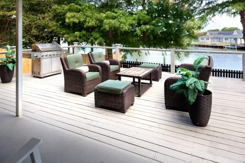 Large deck overlooking the water and boat dock
