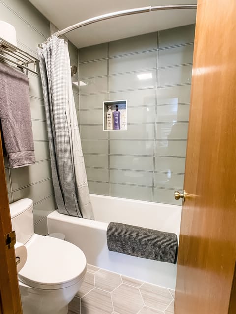 Combined shower/tub, hair dryer, towels, soap