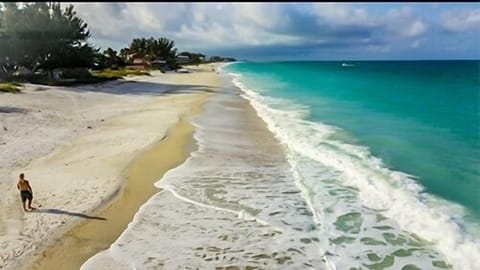 On the beach, sun loungers, beach towels