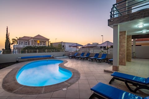 Outdoor pool, a heated pool, sun loungers