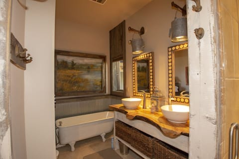 Master bedroom his and her sinks with claw foot soaking tub 