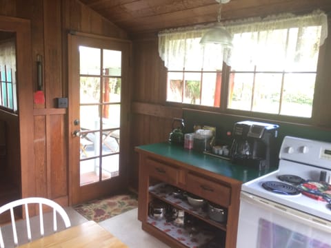 Back entry leads to the covered lanai/BBQ area