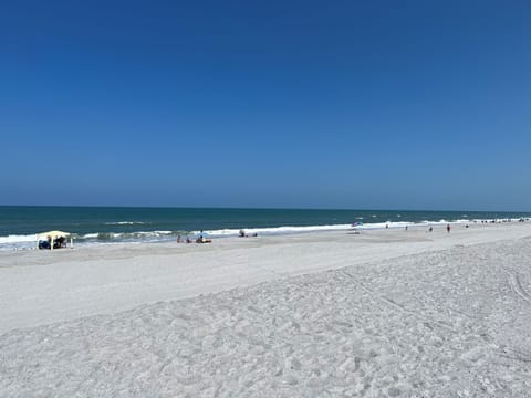 On the beach, sun loungers, beach towels