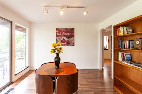 Informal dining room with books & games. 4 top table is no longer in the unit. 