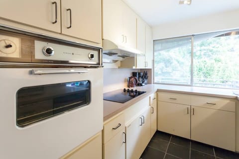 Kitchen view. Equipped with all cooking equipment and utensils.