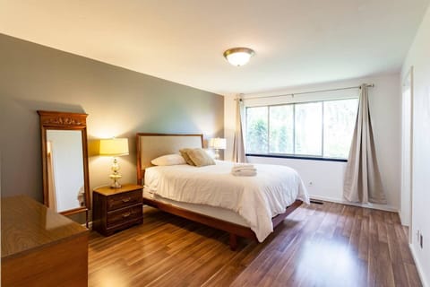 Master Bedroom  - expansive views looking out into the lush greens. His and Hers