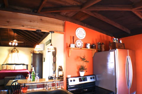Stainless steel kitchen with granite bar - looking to bedroom
