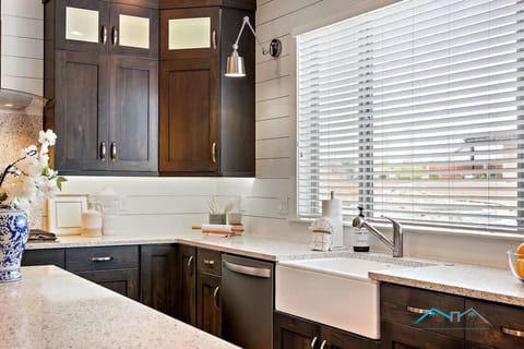 Modern kitchen with farm sink and island and everything needed