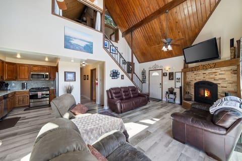 Main floor living room, stairwell, hallway and kitchen