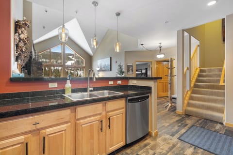 Kitchen featuring stainless steel appliances and breakfast bar.