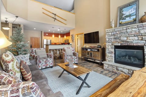 Living area featuring sweeping mountain and slope views.
