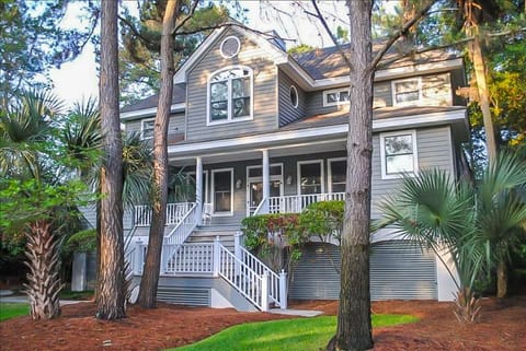 Front of the house. Front porch has rocking chairs.