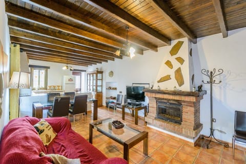 Enjoy the living room of this house with fireplace in Alhaurín el Grande