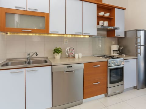 Cabinetry, Kitchen, Room, Countertop, Furniture, Major Appliance, Property, Kitchen Stove, Home Appliance, Cupboard