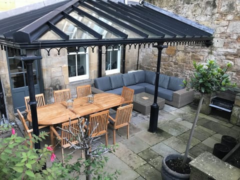 Glass canopy and sitting and dining area