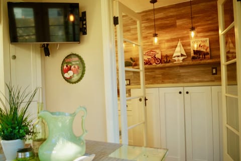 Enjoy watching high definition flat screen TV while sipping a cup of coffee/tea