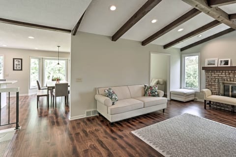 Wood beam ceilings and ample light highlight the formal living room.