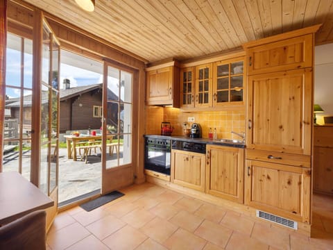 Wood, Furniture, Flooring, Kitchen, Interior Design, Floor, Cabinetry, Countertop, Ceiling, Wood Stain