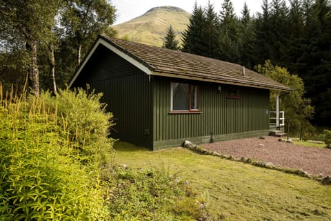 Whooper Lodge with the mountain of Ben More towering above