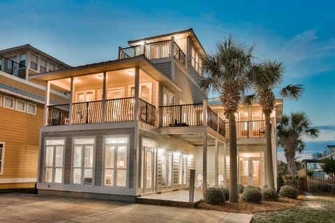 View of front of house with numerous bedrooms/decks with views of Gulf of Mexico
