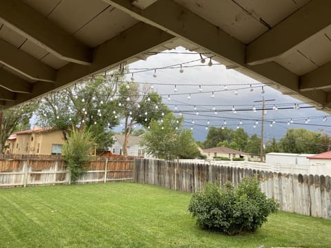 Back yard with tall privacy fence