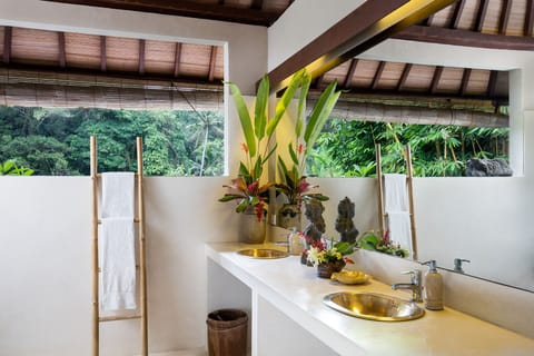 En-suite bathroom with indoor and outdoor shower and double basins.