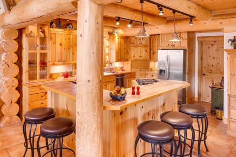 Kitchen fully stocked with every small appliance and gadget needed for cooking.
