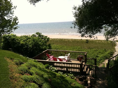 View of the private beach and decks from back yard.