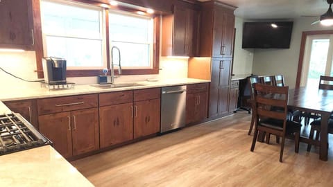 Full-size fridge, microwave, dishwasher, dining tables