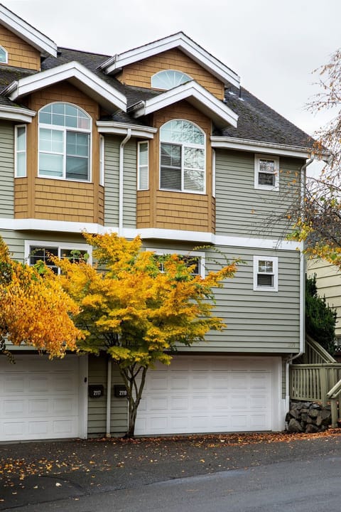 House is on the right. Garage fits one car and the driveway fits one car.
