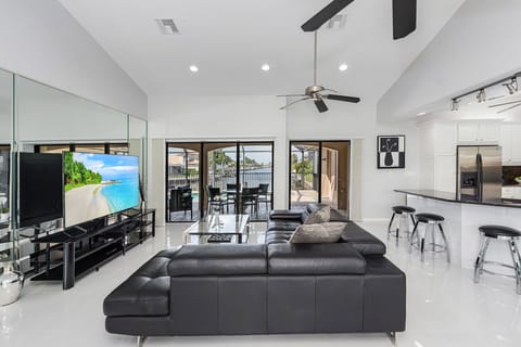 MAIN HOUSE LIVING ROOM WITH 75 INCH TV AND WATERVIEW