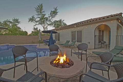 HUGE gas-heated pool & firepit. Plenty of seating & 4 lounges.