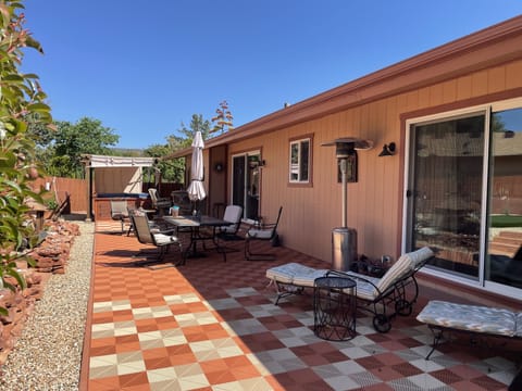 Large backyard with with loungers outdoor eating area